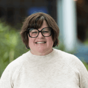 Allison Wagstrom, white woman with brown hair and glasses in a head and shoulders picture.